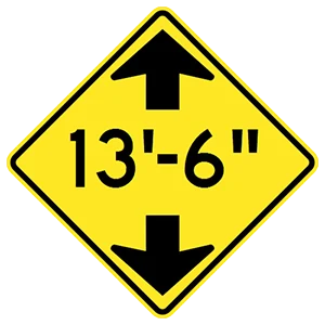 Road sign: The overpass ahead has a low clearance.