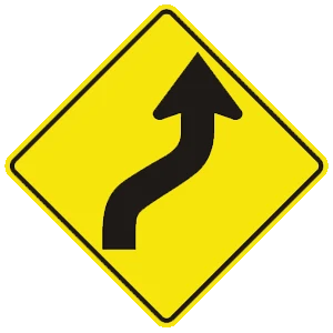 Road sign: The road ahead curves right, then left.