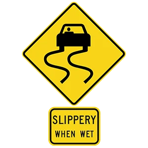 Road sign: When pavement is wet, reduce your speed.