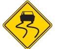 Road sign: Slippery when wet