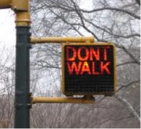 对于行人来说,闪烁的显示“Dot't walk”的信号灯表示: