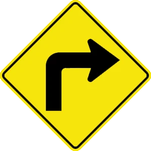 Road sign: Sharp right turn in the road ahead.
