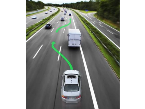 When passing a truck on a two-way highway, a driver should:
