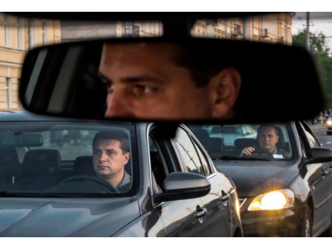 When a driver stops behind another vehicle in a traffic queue, they should: