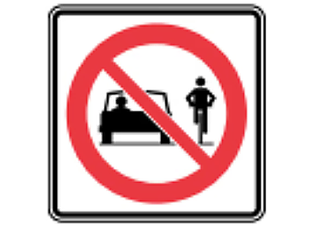 A circular white sign with a red border showing a bicycle with a line through it indicates: